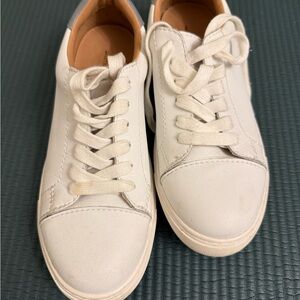 Size 8.5 white shoes. 14th and Union.